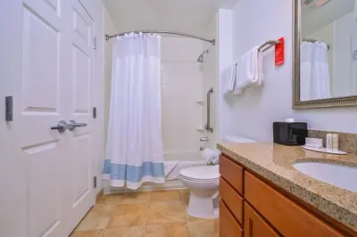 a bathroom with a toilet and a sink and a shower at TownePlace Suites by Marriott Thousand Oaks Ventura County in Thousand Oaks