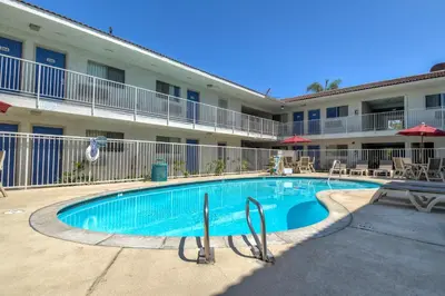 a swimming pool in front of a hotel at Motel 6-Rowland Heights, CA - Los Angeles - Pomona in Rowland Heights
