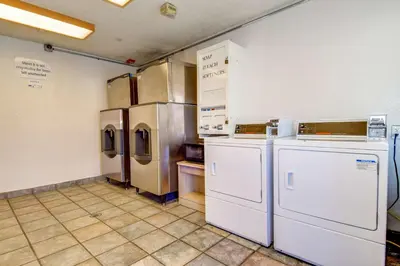 a kitchen with refrigerators and other appliances in it at Motel 6-Riverside, CA - South in Riverside