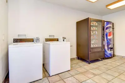 a room with two refrigerators and a soda machine at Motel 6-Riverside, CA - South in Riverside