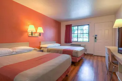 a hotel room with two beds and a television at Motel 6-San Dimas, CA - Los Angeles in San Dimas