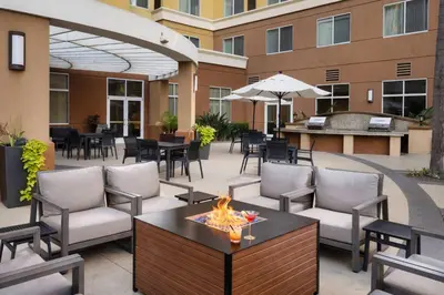 an outdoor patio with chairs and a fire pit at Residence Inn by Marriott Anaheim Resort Area/Garden Grove in Anaheim