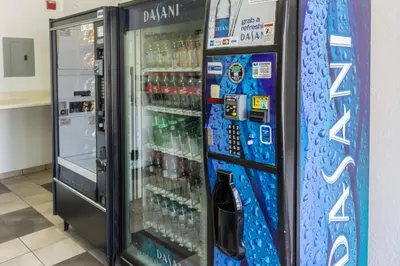 a vending machine filled with lots of bottled drinks at Motel 6 Bakersfield, CA - Convention Center in Bakersfield