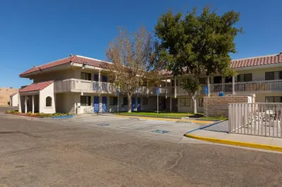 an empty street in front of a building at Motel 6-Barstow, CA in Barstow