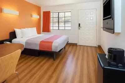 a hotel room with a bed and a television at Motel 6-Thousand Oaks, CA in Thousand Oaks
