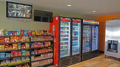 a grocery store with two refrigerators and food at Hawthorne Plaza Inn Near LAX in Hawthorne