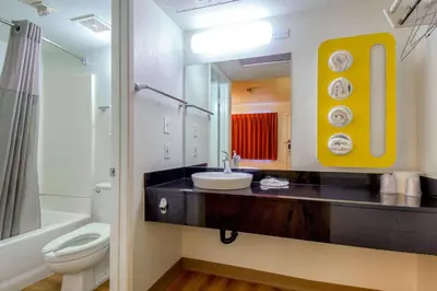 a bathroom with a sink and a toilet and a mirror at Motel 6-Pomona, CA - Los Angeles in Pomona