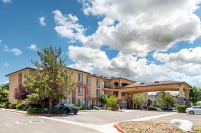 a rendering of a building with a parking lot at Best Western Plus Country Park Hotel in Tehachapi