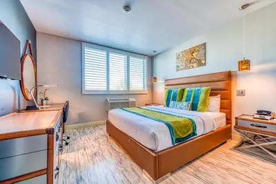 a bedroom with a bed and a desk at Lexen Hotel - North Hollywood Near Universal Studios in North Hollywood
