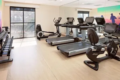 a gym with treadmills and elliptical machines at Hyatt Place Ontario/Rancho Cucamonga in Ontario