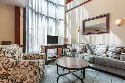 a living room with a couch and a table at Econo Lodge Inn & Suites Riverside - Corona in Riverside