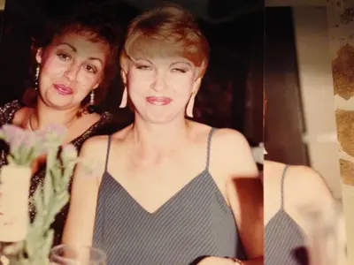 two women standing next to each other in front of a mirror at Timen House in North Hollywood