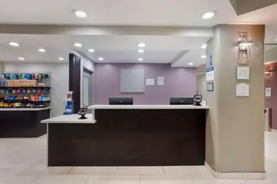 a cashier counter in a store with purple walls at Best Western Plus Commerce Hotel in Los Angeles