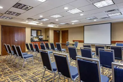 a conference room with chairs and a white screen at Hampton Inn Norco/Corona in Norco
