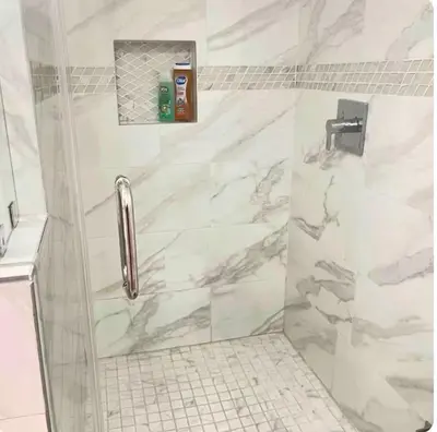 a bathroom with a shower with white marble at Beautiful 4BD and 3BA Pool Jacuzzi Vacation Home in Los Angeles