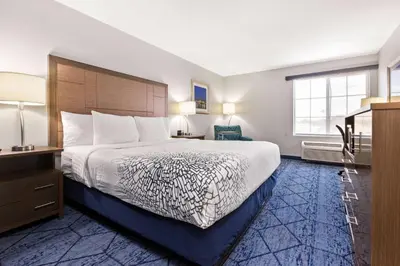 a hotel room with a large bed and a window at La Quinta by Wyndham NE Long Beach/Cypress in Hawaiian Gardens