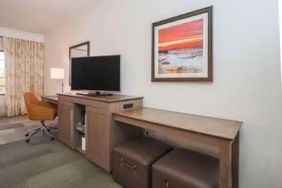 a room with a desk with a flat screen tv at Hampton Inn & Suites Camarillo in Camarillo