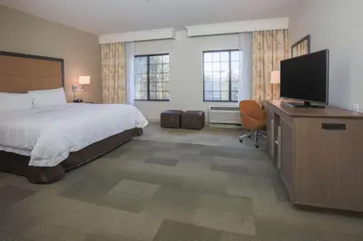 a hotel room with a bed and a flat screen tv at Hampton Inn & Suites Camarillo in Camarillo