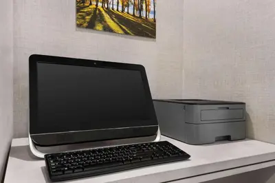 a laptop computer sitting on top of a desk at La Quinta by Wyndham Hesperia Victorville in Hesperia