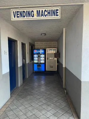 a vending machine in the hallway of a building at Studio 6 Suites San Bernardino, CA in San Bernardino