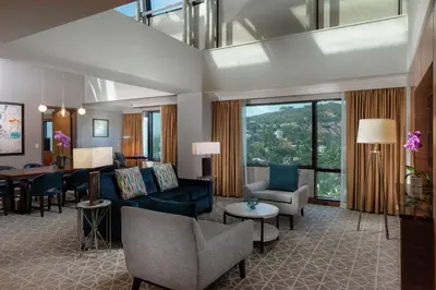 a living room with a couch and a table at Hilton Los Angeles-Universal City in Los Angeles