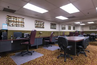 a conference room with a table and chairs at Grand Vista Hotel in Simi Valley