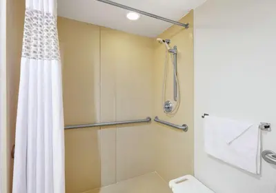 a bathroom with a shower and a toilet at Hampton Inn Los Angeles/Carson in Carson