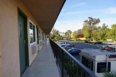 a balcony of a building with a parking lot at Americas Best Value Inn Thousand Oaks in Thousand Oaks