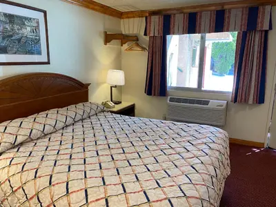 a bedroom with a large bed and a window at Best Inn Rosemead in Rosemead