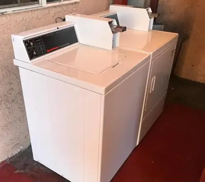 a white desk with two boxes on top of it at Best Inn Rosemead in Rosemead