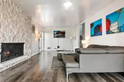 a living room with a couch and a fireplace at 4 bedroom and 3 bath home close to universal studio and Hollywood in Sherman Oaks