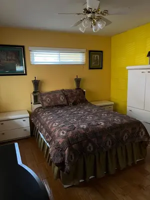 a bedroom with a bed and a ceiling fan at Beautiful Foothill Home in Rancho Cucamonga