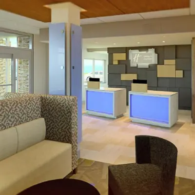 a lobby with a couch and chairs in a building at Holiday Inn Express & Suites Camarillo by IHG in Camarillo