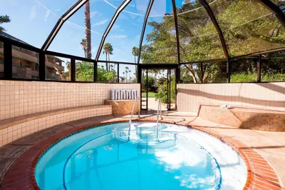 a swimming pool in the middle of a building at Four Points by Sheraton Ventura Harbor Resort in Ventura