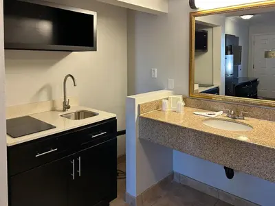 a bathroom with two sinks and a large mirror at Studio 6 Mojave, CA - Airport in Mojave