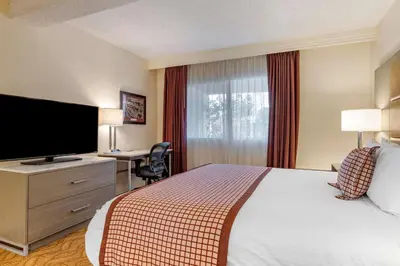 a hotel room with a bed and a flat screen tv at Best Western Plus Thousand Oaks Inn in Thousand Oaks