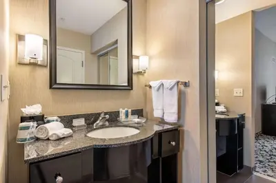a bathroom with a sink and a mirror at Homewood Suites by Hilton Oxnard/Camarillo in Oxnard