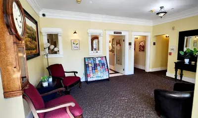 a waiting room with chairs and a sign in it at Santa Paula Inn in Santa Paula