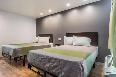 a room with two beds in a room at Studio 6-Buttonwillow, CA in Buttonwillow