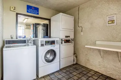 a laundry room with a washer and dryer at Studio 6-Buttonwillow, CA in Buttonwillow