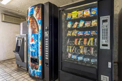 a vending machine filled with lots of drinks at Studio 6-Buttonwillow, CA in Buttonwillow
