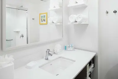 a white bathroom with a sink and a mirror at Hampton Inn Los Angeles Santa Clarita in Santa Clarita