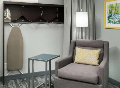 a living room with a chair and a table at Hampton Inn Los Angeles Santa Clarita in Santa Clarita