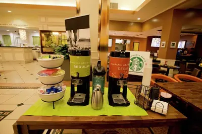 a table with some bottles of wine on it at Hilton Garden Inn Oxnard/Camarillo in Oxnard