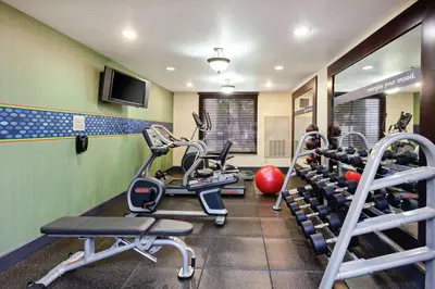 a gym with treadmills and weights in a room at Hampton Inn Los Angeles/Arcadia in Arcadia