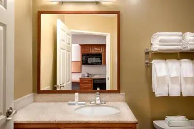 a bathroom with a sink and a mirror at Candlewood Suites LAX Hawthorne by IHG in Hawthorne