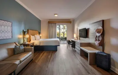a hotel room with a bed and a couch at Ayres Hotel Chino Hills Ontario in Chino Hills