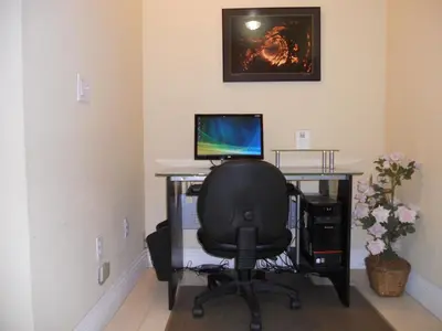 an office with a desk with a computer and a chair at Hotel Pacific, Manhattan Beach in Manhattan Beach