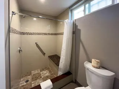 a bathroom with a shower and a toilet at Motel 6 Pico Rivera - Los Angeles, CA in Pico Rivera