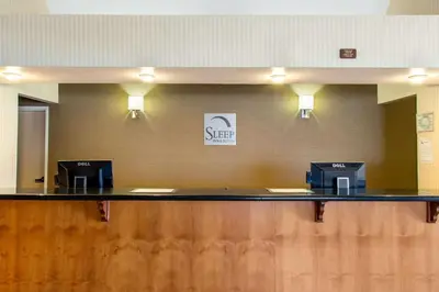 a check in counter with two computers on it at Sleep Inn & Suites Bakersfield North in Bakersfield